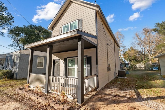 view of front of property with central AC and a porch