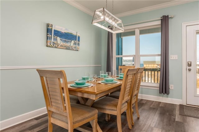 dining area with dark wood-style floors, baseboards, and crown molding