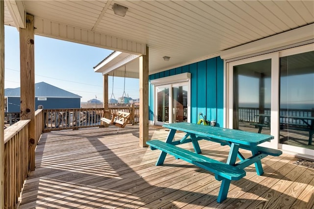 deck featuring outdoor dining area