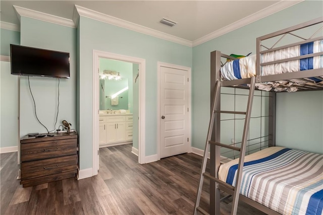 bedroom featuring dark wood-style flooring, visible vents, ornamental molding, connected bathroom, and baseboards