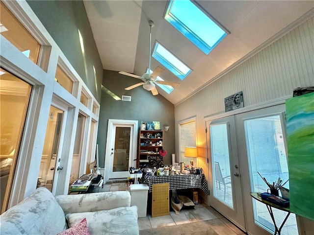 office area featuring a skylight, french doors, and light tile patterned floors