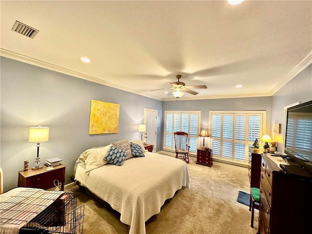 carpeted bedroom with ceiling fan and crown molding