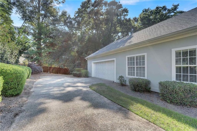 view of property exterior with a garage