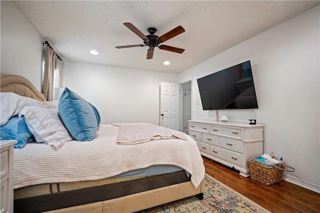 bedroom with recessed lighting, baseboards, a ceiling fan, a textured ceiling, and dark wood-type flooring