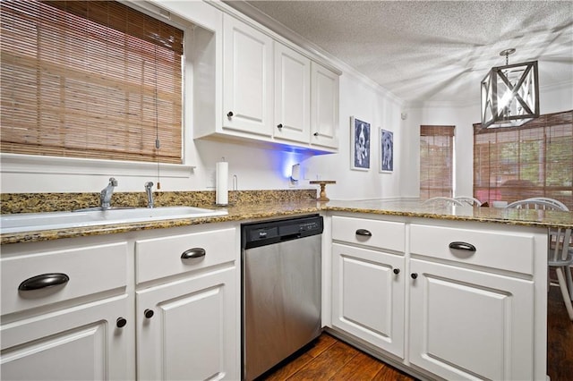 kitchen with stainless steel dishwasher, a textured ceiling, a sink, white cabinetry, and a peninsula
