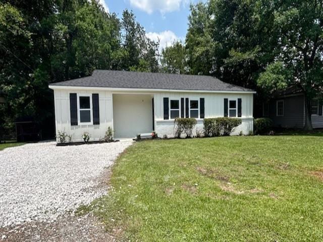 3512 Springhill Ave, Mobile, AL 36608 - single story home with a front yard and gravel driveway