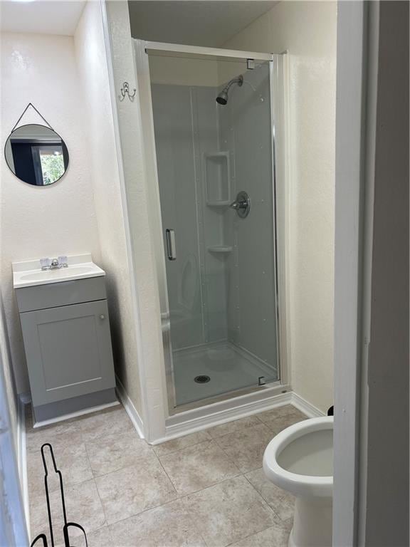 bathroom featuring an enclosed shower and vanity