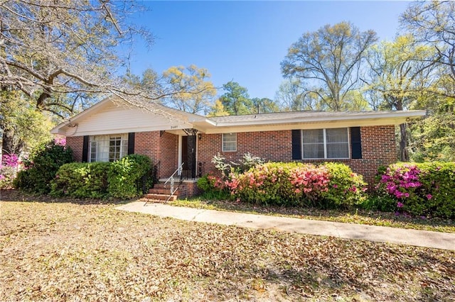 single story home with brick siding