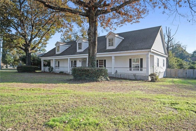 cape cod home featuring fence, a porch, and a front yard