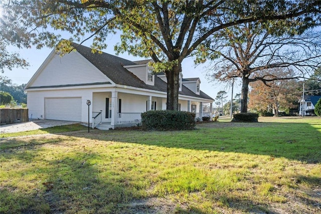 view of front of house featuring a garage, covered porch, a front lawn, and concrete driveway