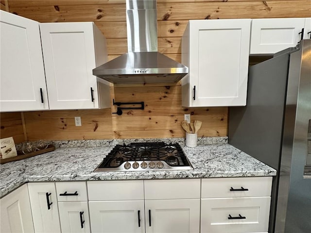 1401 Osprey Ln, Dauphin Island, AL 36528 - kitchen featuring ventilation hood, light stone countertops, stainless steel appliances, and white cabinetry