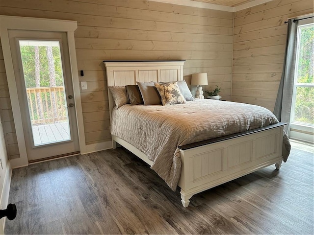 1401 Osprey Ln, Dauphin Island, AL 36528 - bedroom featuring wooden walls, access to outside, and wood finished floors