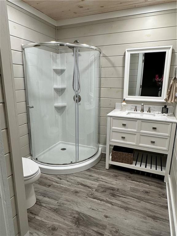 1401 Osprey Ln, Dauphin Island, AL 36528 - bathroom featuring vanity, a stall shower, and wood finished floors
