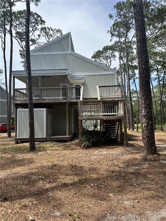 1401 Osprey Ln, Dauphin Island, AL 36528 - rear view of house with a wooden deck