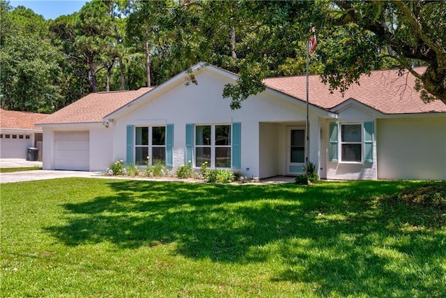 ranch-style house with a garage and a front lawn