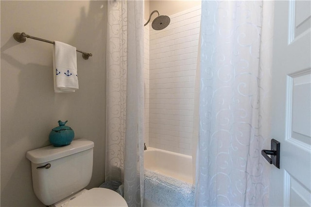 full bathroom with toilet and shower / bathtub combination with curtain
