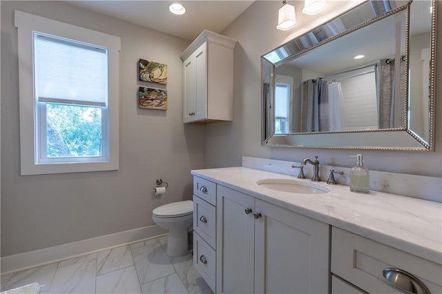 full bathroom featuring healthy amount of natural light, baseboards, marble look tile flooring, vanity, and recessed lighting