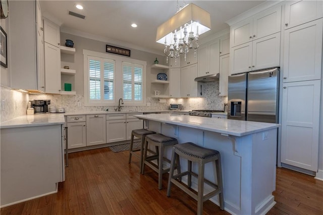 kitchen with open shelves, stainless steel fridge with ice dispenser, under cabinet range hood, ornamental molding, and a sink