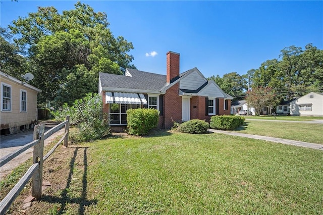 bungalow-style home featuring a front yard