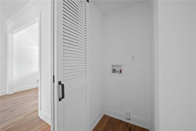 washroom featuring washer hookup and light hardwood / wood-style flooring