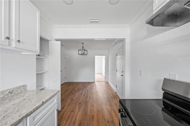 kitchen with white cabinetry, electric stove, light stone countertops, ornamental molding, and dark hardwood / wood-style floors