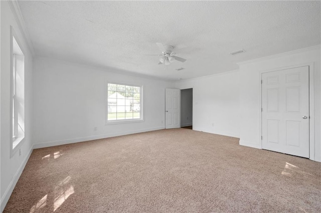 spare room with ceiling fan, carpet flooring, and a textured ceiling