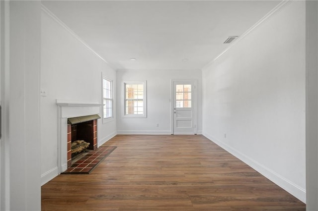 unfurnished living room with wood-type flooring, a fireplace, and ornamental molding