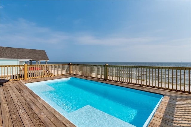 pool with a deck with water view