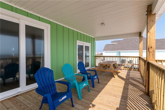 wooden deck featuring outdoor dining area