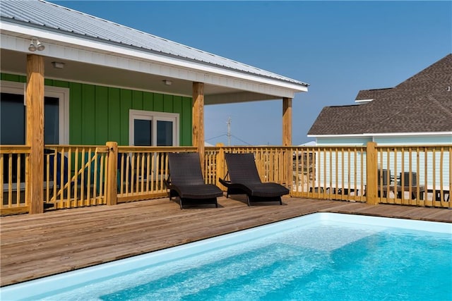 view of pool with a deck and a fenced in pool