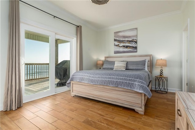 bedroom with ornamental molding, access to outside, and light wood finished floors