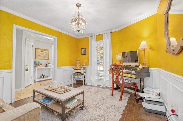 interior space with hardwood / wood-style flooring, a notable chandelier, and ornamental molding