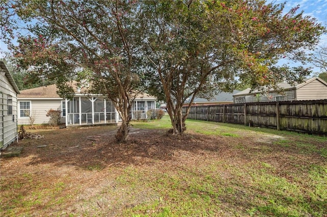 view of yard featuring a sunroom