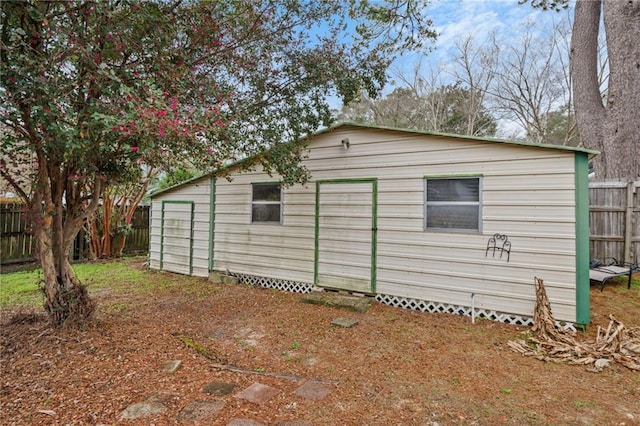 view of home's exterior with an outdoor structure