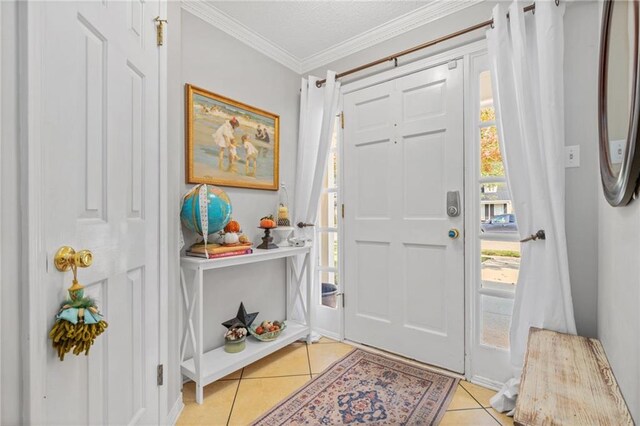 tiled foyer entrance with crown molding