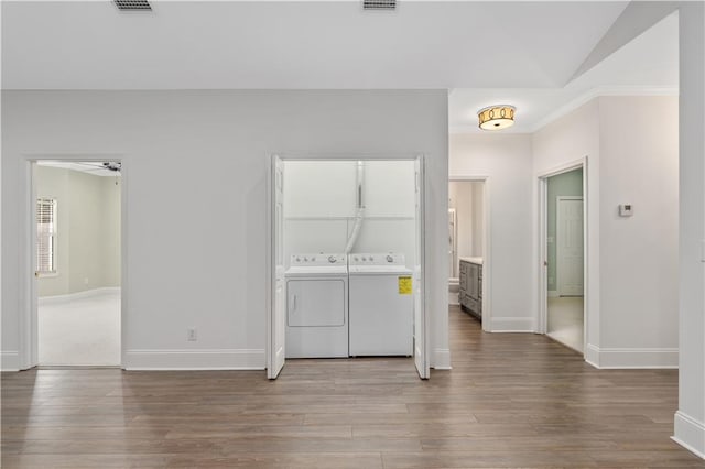 unfurnished bedroom featuring connected bathroom, separate washer and dryer, and carpet floors