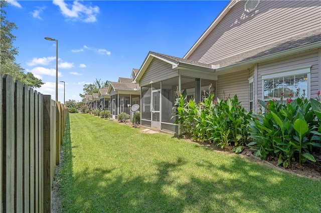 view of yard featuring a sunroom