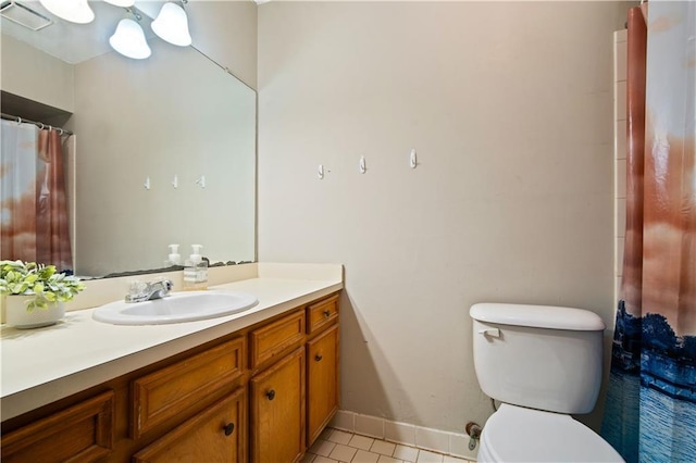 9731 Hamilton Creek Dr S, Mobile, AL 36695 - bathroom with tile patterned floors, toilet, vanity, and baseboards