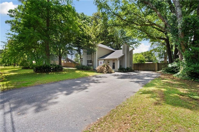 9731 Hamilton Creek Dr S, Mobile, AL 36695 - view of front of home with asphalt driveway and a chimney
