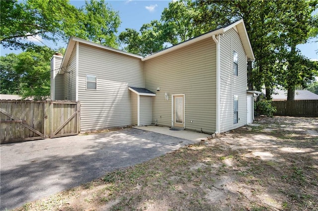 9731 Hamilton Creek Dr S, Mobile, AL 36695 - rear view of property featuring fence and a patio area