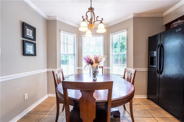 13330 Wages Ct, Mobile, AL 36695 - dining space featuring light tile patterned flooring, a chandelier, crown molding, a textured ceiling, and baseboards