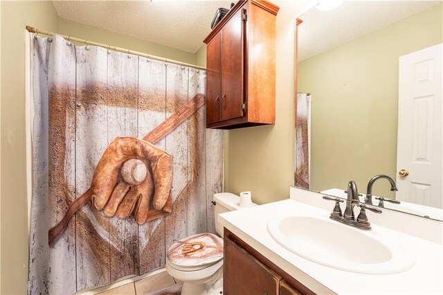 13330 Wages Ct, Mobile, AL 36695 - full bathroom featuring toilet, vanity, a textured ceiling, and tile patterned floors