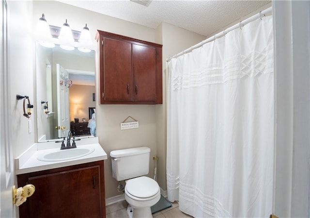 13330 Wages Ct, Mobile, AL 36695 - full bathroom with toilet, vanity, a textured ceiling, connected bathroom, and tile patterned flooring