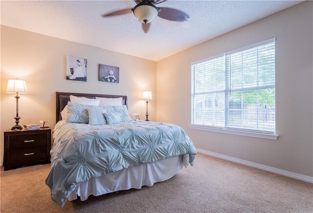13330 Wages Ct, Mobile, AL 36695 - bedroom featuring multiple windows, carpet flooring, baseboards, and a textured ceiling