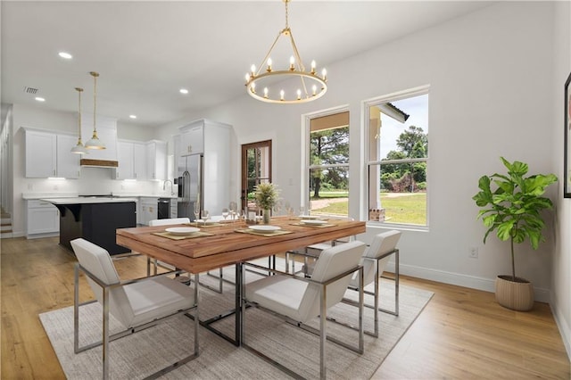 5305 Laurendine Rd, Theodore, AL 36582 - dining space featuring light wood-style flooring, a chandelier, and recessed lighting
