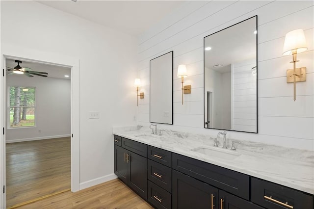 5305 Laurendine Rd, Theodore, AL 36582 - full bathroom featuring double vanity, wood finished floors, and a ceiling fan