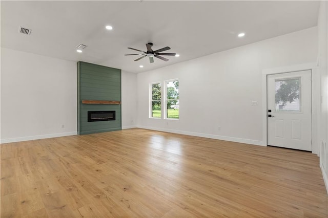 5305 Laurendine Rd, Theodore, AL 36582 - unfurnished living room with ceiling fan, a large fireplace, light wood-type flooring, and recessed lighting