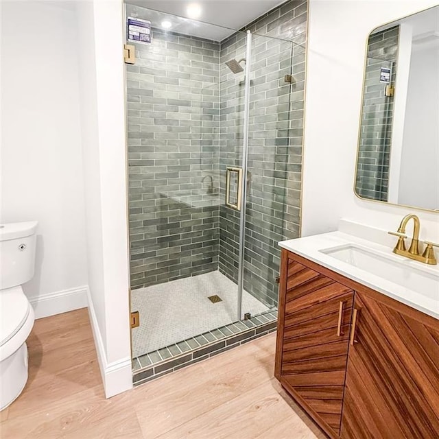 7498 Pinehill Rd, Daphne, AL 36526 - full bathroom with wood finished floors, vanity, and a stall shower
