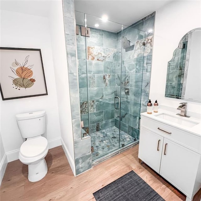 7498 Pinehill Rd, Daphne, AL 36526 - bathroom featuring wood finished floors, vanity, a stall shower, and recessed lighting