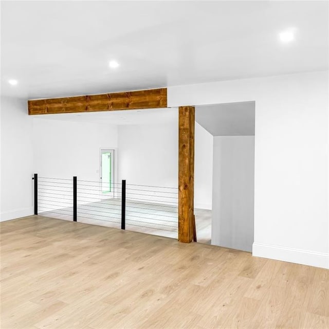 7498 Pinehill Rd, Daphne, AL 36526 - spare room featuring light wood-type flooring, beam ceiling, and recessed lighting